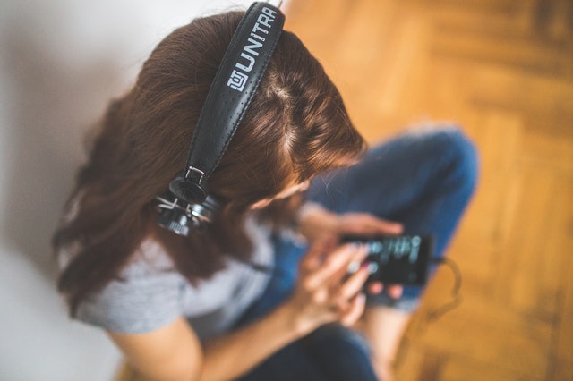 Girl with headphones listening to music