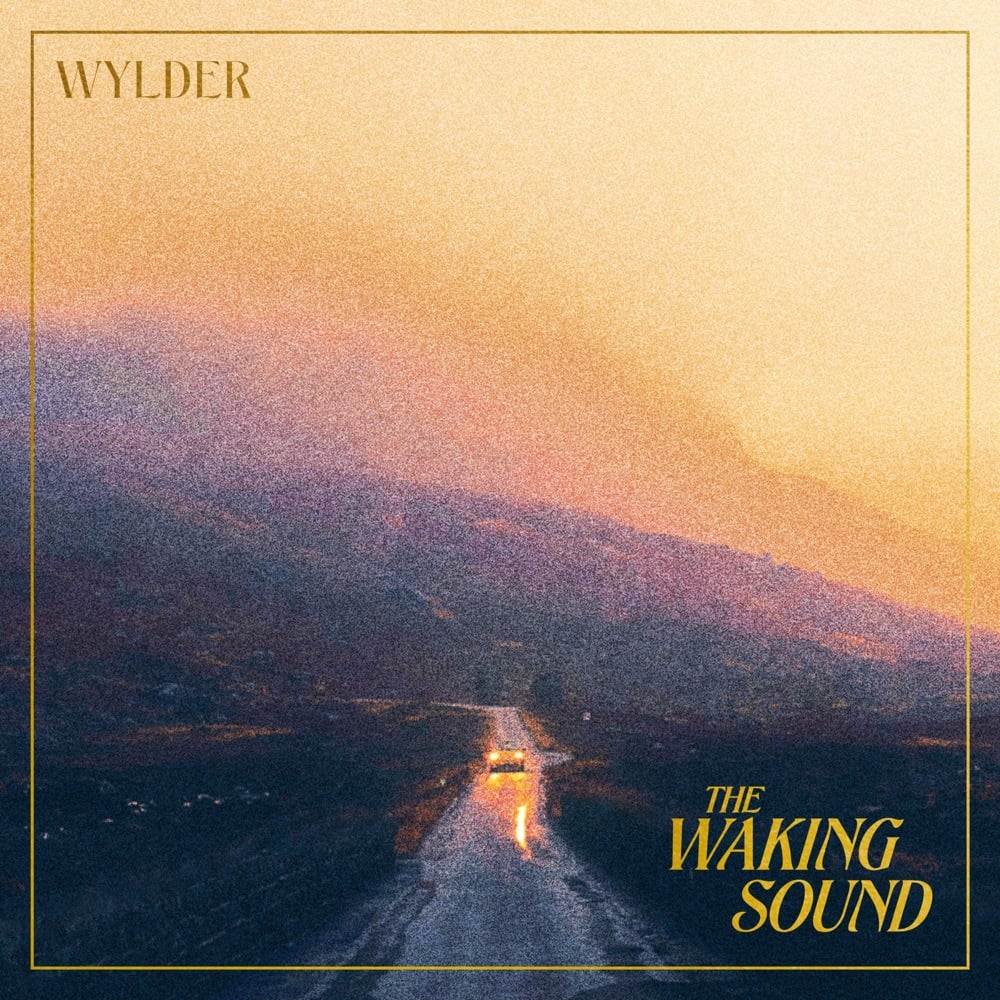 Illustrated background depicting ellowyellow, orange, blue, grey, and purple hues over a dark landscape below. Yellow stylized text in the lower right corner says, "The waking sound"